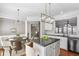 Well-appointed kitchen with granite countertops, white cabinets, and stainless steel appliances at 4718 Wehunt Se Trl # 20, Smyrna, GA 30082