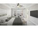 Spacious main bedroom with a tray ceiling, a fan, a large window, and sitting area at 4718 Wehunt Se Trl # 20, Smyrna, GA 30082