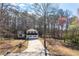 Aerial view of a charming home nestled amongst mature trees, offering privacy and seclusion at 6730 Alvan Ct, Riverdale, GA 30296