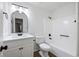 Modern bathroom featuring updated vanity, mirror, and bathtub with black fixtures at 6730 Alvan Ct, Riverdale, GA 30296