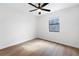 Bright bedroom featuring a ceiling fan and natural light from a single window at 6730 Alvan Ct, Riverdale, GA 30296