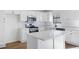 Bright kitchen featuring white cabinets, stainless steel appliances, and an island with countertop seating at 6730 Alvan Ct, Riverdale, GA 30296