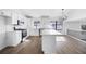 Modern kitchen boasts sleek white cabinets, stainless steel appliances, and a center island at 6730 Alvan Ct, Riverdale, GA 30296
