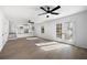 Sunlit living room leads to breakfast bar seating and a cozy kitchen at 6730 Alvan Ct, Riverdale, GA 30296