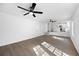 Bright living room features an open floor plan and modern ceiling fan at 6730 Alvan Ct, Riverdale, GA 30296
