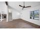 Open-concept living room features hardwood floors and easy access to the kitchen and staircase at 6730 Alvan Ct, Riverdale, GA 30296