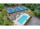 Aerial view of community pool, tennis courts, and playground at 1544 Blue Bird Way, Cumming, GA 30041