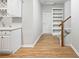 Finished basement with wet bar, built-in shelving, and wood-look flooring at 1544 Blue Bird Way, Cumming, GA 30041