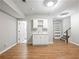 Finished basement with a bar, hardwood floors, and recessed lighting, perfect for entertaining at 1544 Blue Bird Way, Cumming, GA 30041