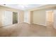 This bedroom has neutral carpeting and many points of access at 1544 Blue Bird Way, Cumming, GA 30041