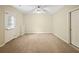 Bedroom with carpet, ceiling fan, and access to the outdoors at 1544 Blue Bird Way, Cumming, GA 30041