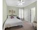 Charming bedroom featuring a bed, a window, and carpeted floor, painted in a relaxing green at 1544 Blue Bird Way, Cumming, GA 30041