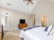 Light-filled bedroom showcases access to the outdoors and ensuite bath, vaulted ceiling, and neutral decor at 1544 Blue Bird Way, Cumming, GA 30041