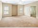 Spacious bedroom with ample natural light and neutral carpeting at 1544 Blue Bird Way, Cumming, GA 30041
