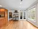 Bright breakfast nook featuring a table and chairs, hardwood flooring, and large windows at 1544 Blue Bird Way, Cumming, GA 30041