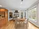 Bright breakfast nook featuring a dining table and chairs, hardwood flooring, and large windows at 1544 Blue Bird Way, Cumming, GA 30041