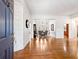 Elegant foyer with hardwood floors, high ceilings, and view of the formal dining room at 1544 Blue Bird Way, Cumming, GA 30041