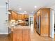 Well-equipped kitchen featuring wooden cabinets and stainless steel appliances and hardwood floors at 1544 Blue Bird Way, Cumming, GA 30041
