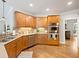 Charming kitchen boasting stainless steel appliances, light countertops, and hardwood floors at 1544 Blue Bird Way, Cumming, GA 30041