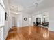 Bright living room with hardwood floors, ceiling fan, and open access to dining area at 1544 Blue Bird Way, Cumming, GA 30041