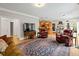 Spacious living area showcasing hardwood floors, classic furniture, and a seamless flow at 1544 Blue Bird Way, Cumming, GA 30041