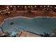 Relaxing outdoor swimming pool with stone decking, patio furniture, and ambient string lights for evening swims at 1544 Blue Bird Way, Cumming, GA 30041