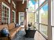 Inviting screened porch with comfortable seating and views of the lush, green surroundings at 1544 Blue Bird Way, Cumming, GA 30041