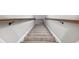 Carpeted stairway with wooden handrails at 1544 Blue Bird Way, Cumming, GA 30041