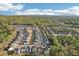 An aerial view capturing a vibrant community with a swimming pool surrounded by nature and manicured landscapes at 278 Tillman Pass, Woodstock, GA 30188