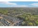 Expansive aerial shot capturing a modern community nestled among lush greenery and natural landscapes at 278 Tillman Pass, Woodstock, GA 30188