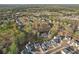 Breathtaking aerial view showcasing a neighborhood with both natural beauty and a serene lake environment at 278 Tillman Pass, Woodstock, GA 30188