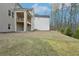 The backyard showing muted siding with a lawn, a covered deck, and patio at 278 Tillman Pass, Woodstock, GA 30188