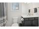 This bathroom features a vanity with a countertop and a toilet with a gray-striped shower curtain at 278 Tillman Pass, Woodstock, GA 30188