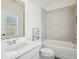 Bathroom featuring gray tile, shower-tub combination, and single sink vanity at 278 Tillman Pass, Woodstock, GA 30188