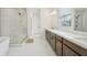 Large bathroom with walk-in glass shower, garden tub, double vanity, and plenty of natural light at 278 Tillman Pass, Woodstock, GA 30188
