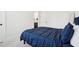 A comfortable bedroom features plush carpeting, and a comfortable blue bed at 278 Tillman Pass, Woodstock, GA 30188