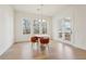 Chic dining space featuring a view to the outdoor balcony and seating for Gathering and guests at 278 Tillman Pass, Woodstock, GA 30188