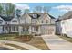 Picturesque two-story home with a front-facing garage, a covered porch, and a well-manicured lawn at 278 Tillman Pass, Woodstock, GA 30188