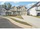 Charming two-story home with a spacious driveway, attached garage, and well-maintained landscaping at 278 Tillman Pass, Woodstock, GA 30188
