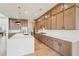 The kitchen offers lots of cabinet space, a large island, stainless steel appliances and wood floors at 278 Tillman Pass, Woodstock, GA 30188