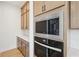 The kitchen features stainless steel microwave and oven appliances with adjacent countertop and cabinet space at 278 Tillman Pass, Woodstock, GA 30188