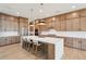 This spacious kitchen features a large island with seating, stainless steel appliances, and beautiful countertops at 278 Tillman Pass, Woodstock, GA 30188