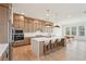 Spacious kitchen with a large island, stainless steel appliances, and an adjacent dining area at 278 Tillman Pass, Woodstock, GA 30188