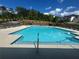 Sparkling community pool with lounge chairs for relaxing poolside on a sunny day at 278 Tillman Pass, Woodstock, GA 30188