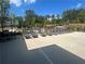 Resort-style pool deck featuring comfortable lounge chairs for sunbathing at 278 Tillman Pass, Woodstock, GA 30188