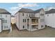 The rear exterior reveals a charming deck, covered patio, and abundant windows at 278 Tillman Pass, Woodstock, GA 30188