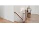 Wooden staircase with white walls and wood accents leading upstairs at 278 Tillman Pass, Woodstock, GA 30188