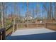View of the wooden deck and large treed backyard at 4843 Caboose Nw Ln, Acworth, GA 30102