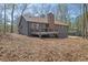 Backyard view with a deck attached to the house at 4843 Caboose Nw Ln, Acworth, GA 30102