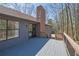 Exterior view from a raised wooden deck looking out over the treed yard at 4843 Caboose Nw Ln, Acworth, GA 30102
